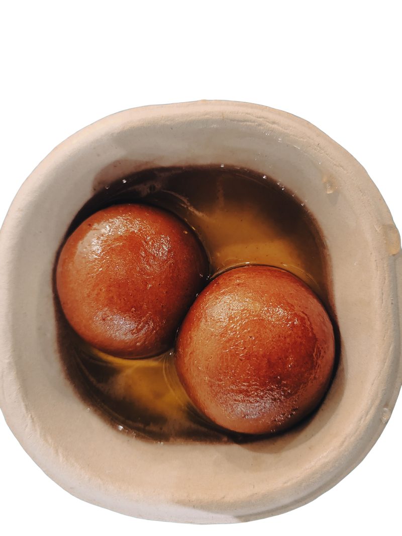 Warm gulab jamun in syrup