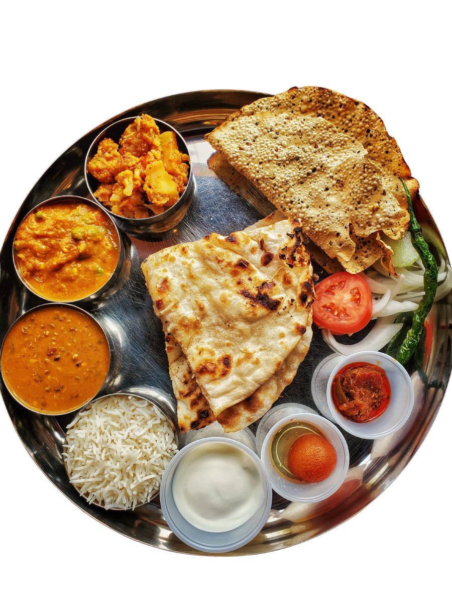 Homestyle veg thali with roti, dal, and sides